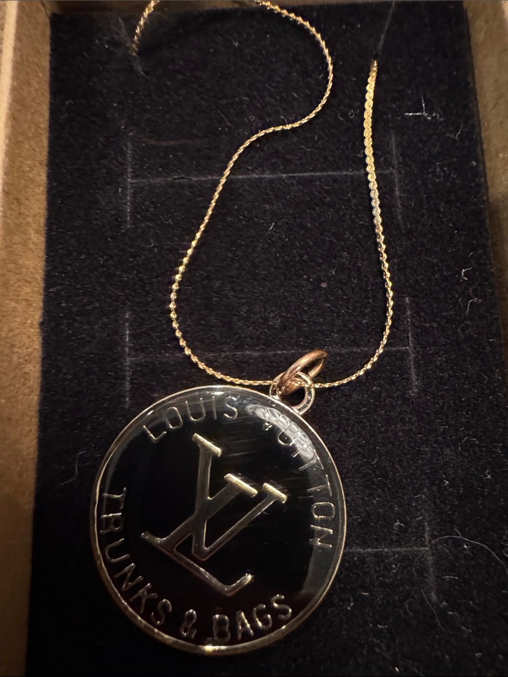 Gold-Tone Necklace with Black Round Logo Pendant